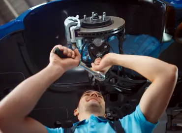 mechanic repairs mercedes benz engine 